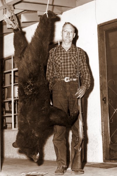 1955 George and bear on the porch in Ruidoso